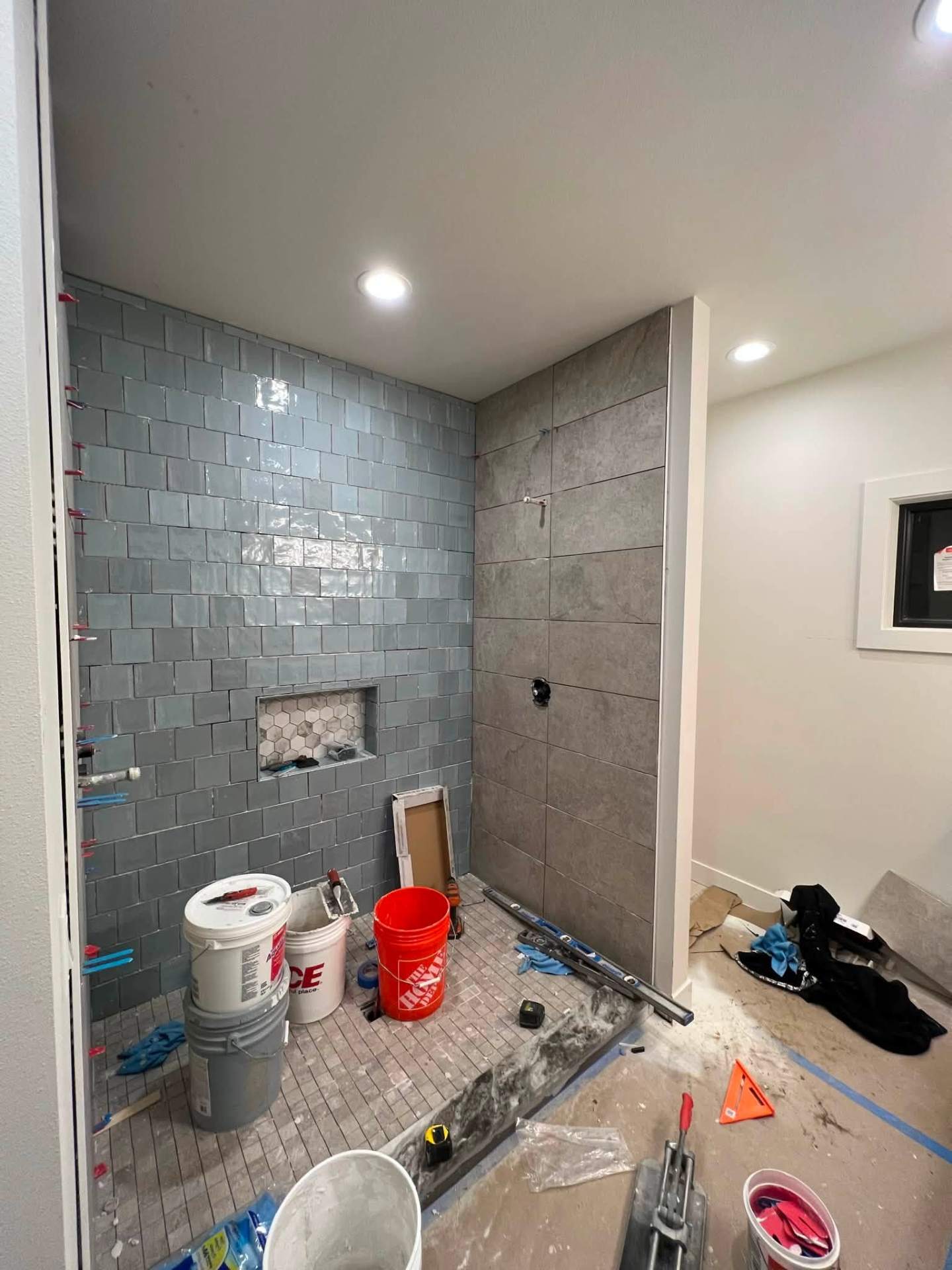 Mixed-tile walk-in shower in progress